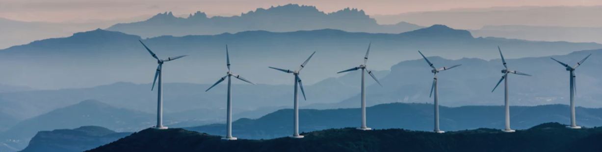 Wind turbines across a mountain landscape